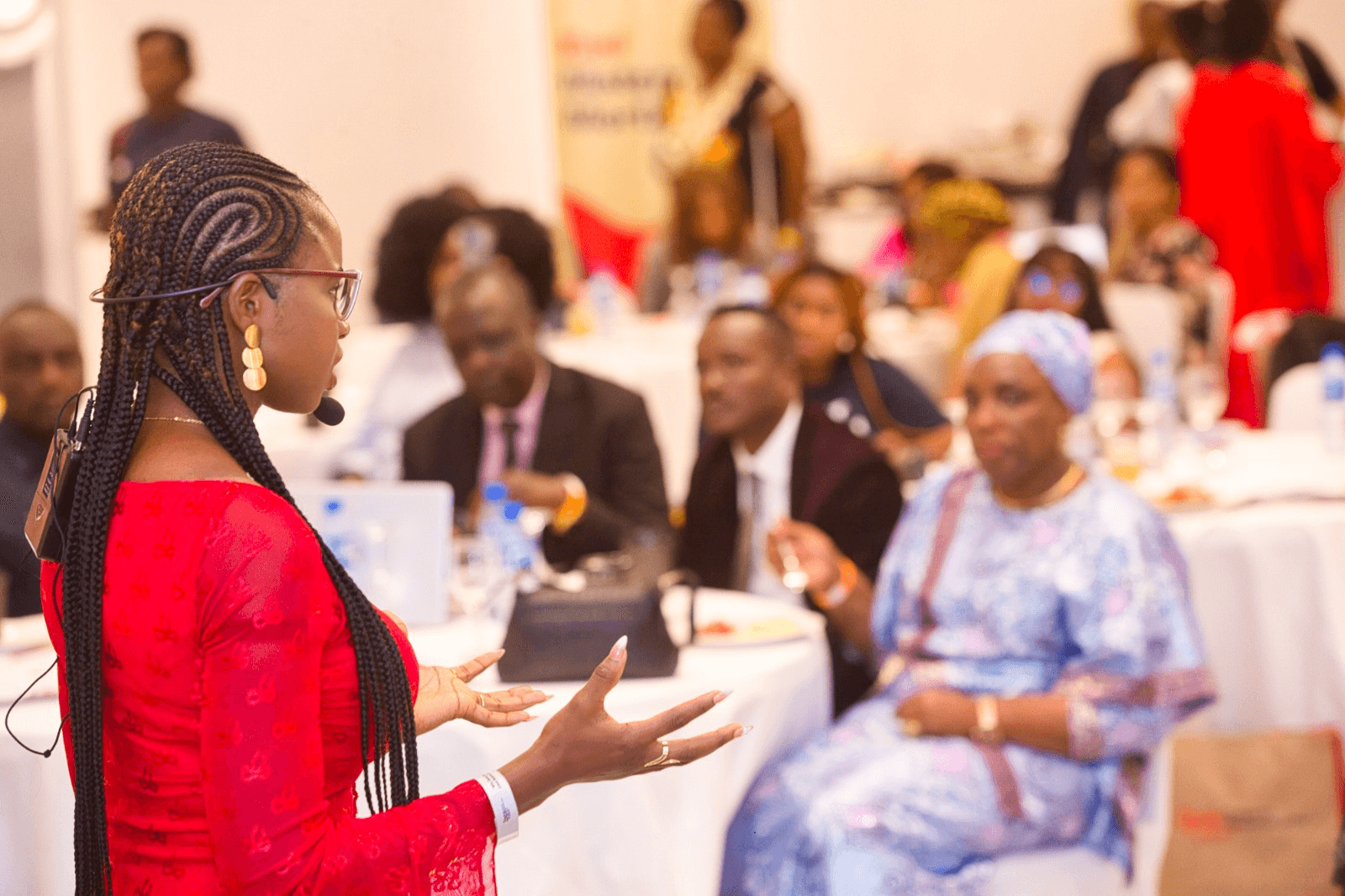 Diverse professionals discussing strategy around a digital tablet in a modern office
